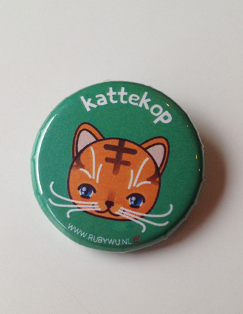 groene button met illustratie van een poes met de tekst kattekop